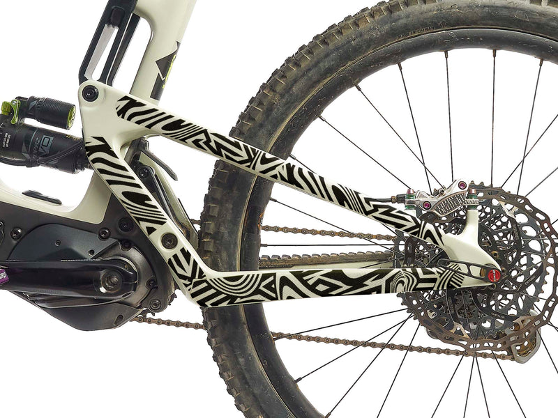 AMS Frame Guard in Full Size Combat Camo design black version on the stays of a clear colored mtb