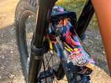 AMS X Red Bull Rampage 2022 red and orange mud guard on a bike fork