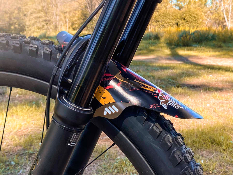 AMS X Red Bull Rampage 2022 red and orange mud guard on a bike fork side view