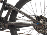 AMS Tracks design Frame Guard in Extra size white option on the swingarm of a bike